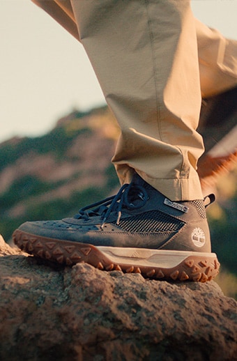 Knee-down photo of a person hiking.